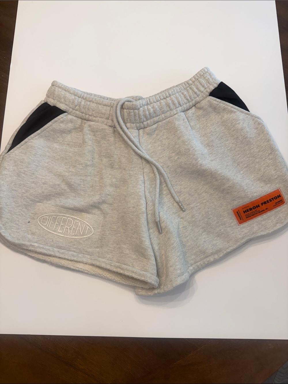 Heron Preston Gray Athletic Shorts with Black Accents and Orange Logo